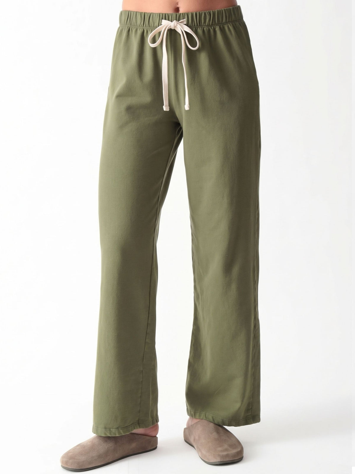 Woman wearing an olive green oversized V-neck sweatshirt with balloon sleeves and matching wide-leg sweatpants by Electric & Rose