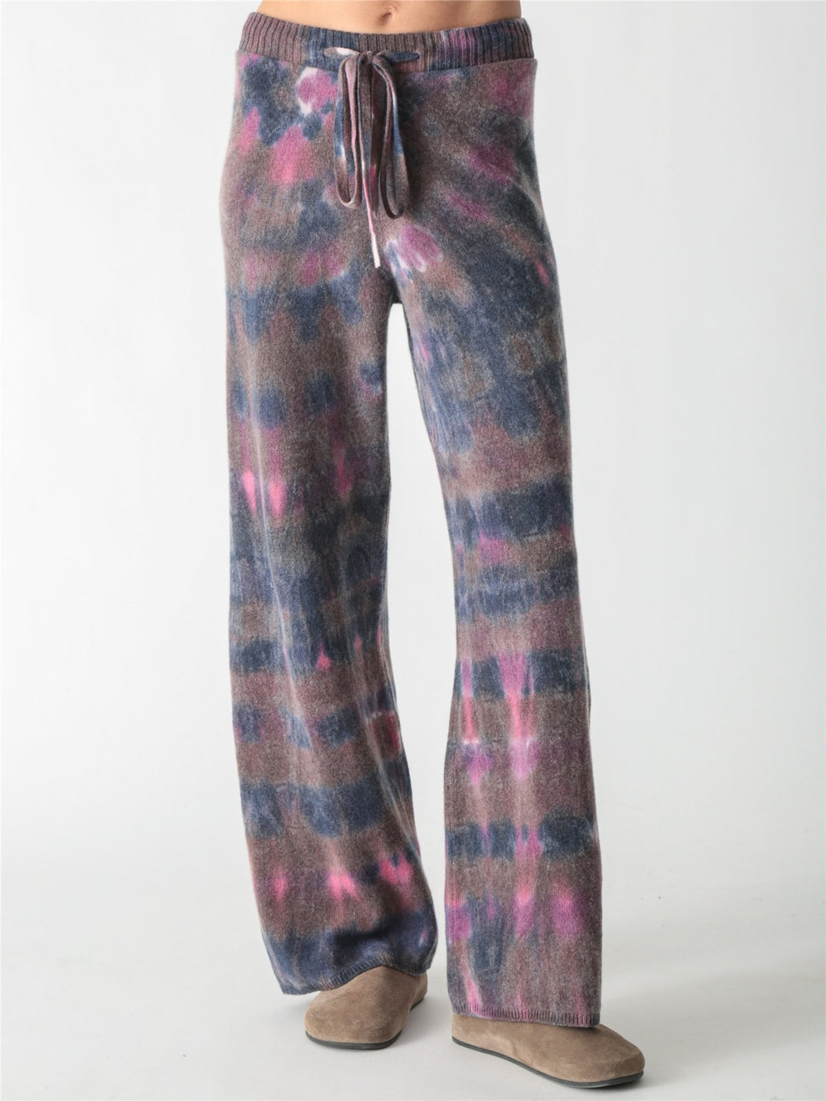 High-waisted, wide-leg knit pants with an adjustable drawstring waist, featuring a tie-dye pattern in charcoal gray, soft purple, and bright pink accents.