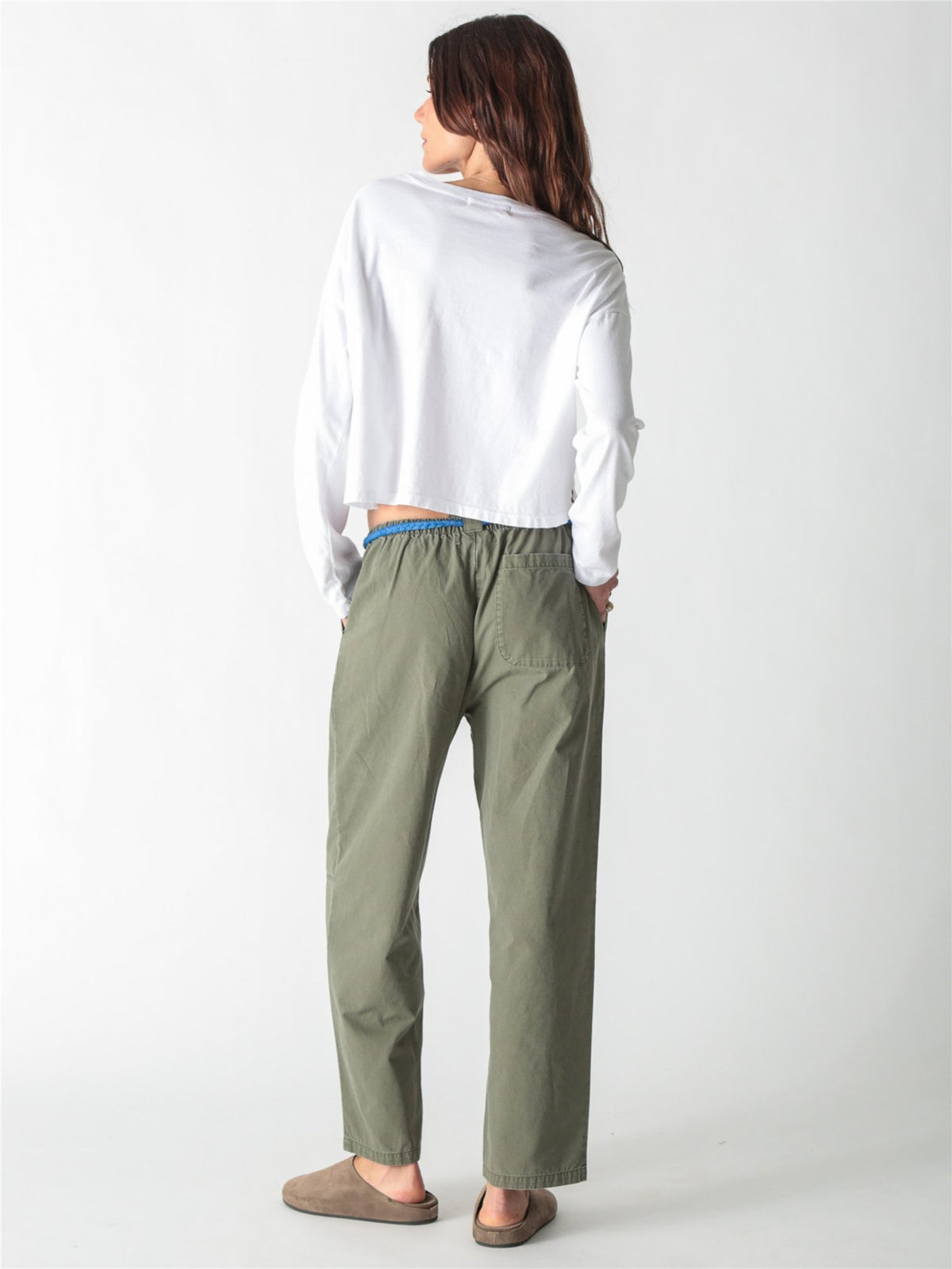 Olive green relaxed straight-leg pants with a bright blue rope drawstring waist and horizontal knee seam details.