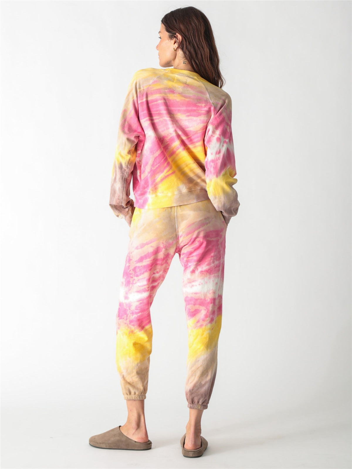 Vibrant pink, yellow, and tan tie-dye crewneck sweatshirt with long relaxed sleeves.