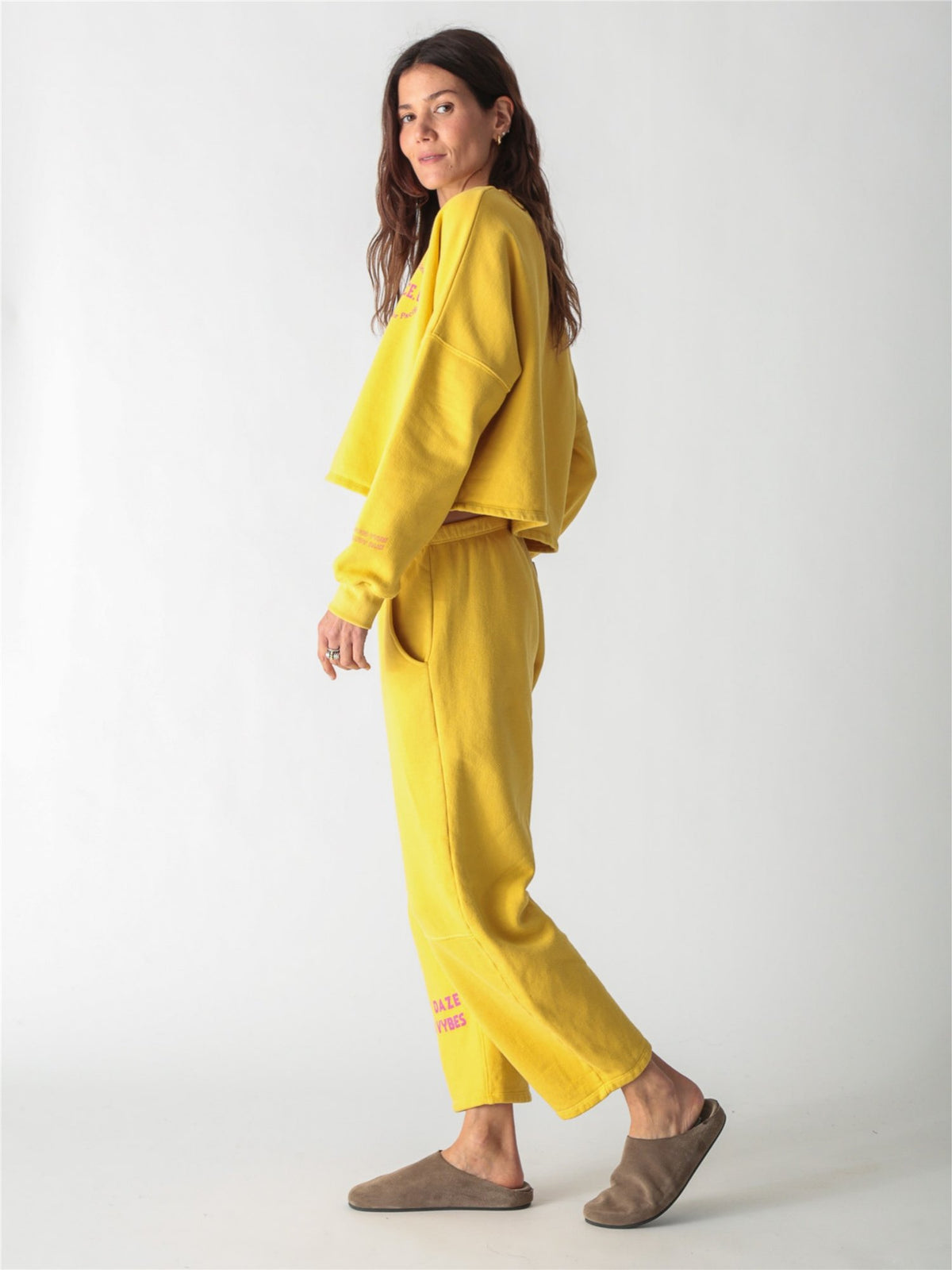 A yellow oversized cropped crewneck sweatshirt with dropped shoulders and ribbed cuffs.