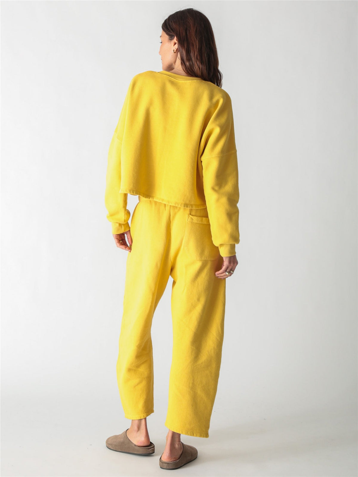 A yellow oversized cropped crewneck sweatshirt with dropped shoulders and ribbed cuffs.