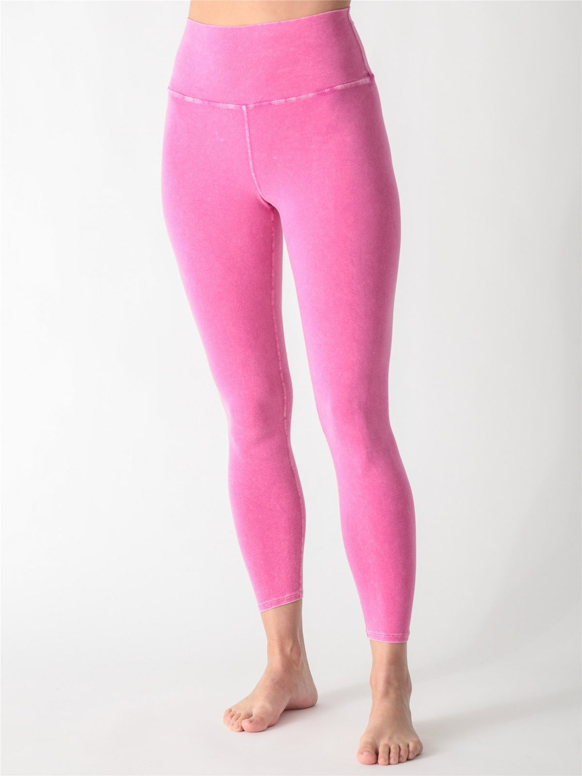 Mineral-washed hot pink high-waisted performance leggings.