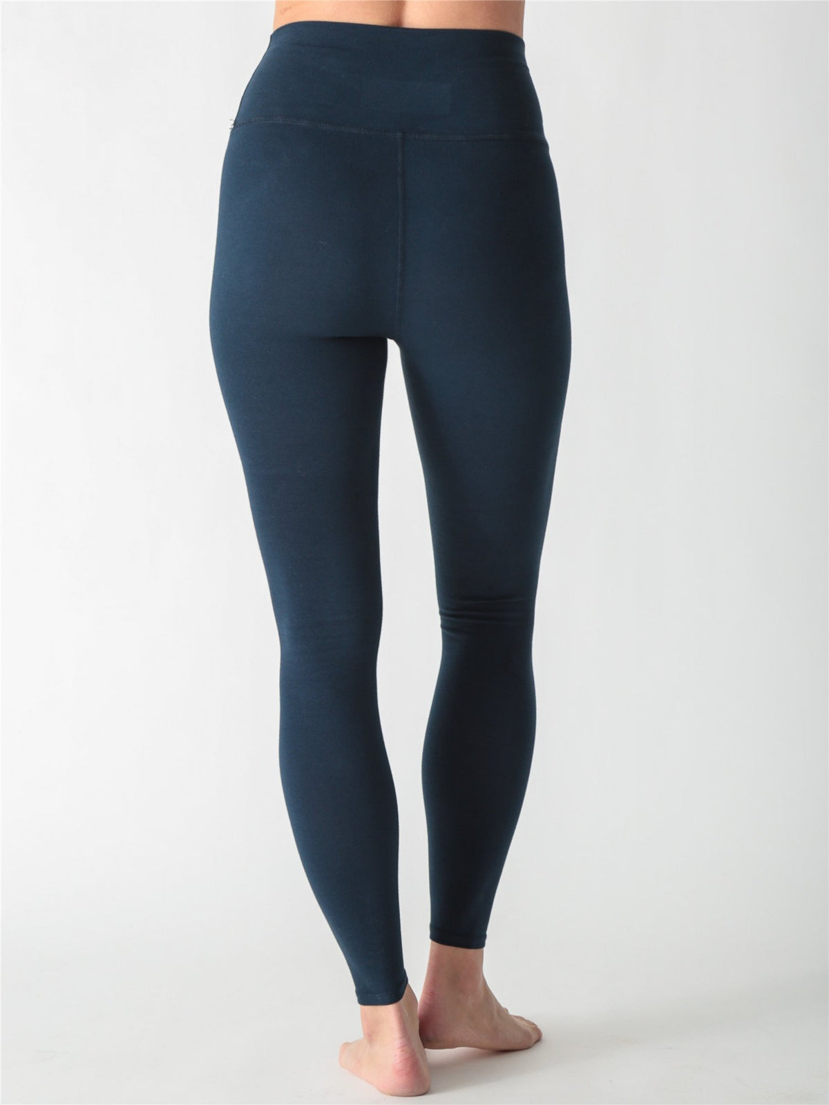 Dark navy blue high-waisted performance leggings.
