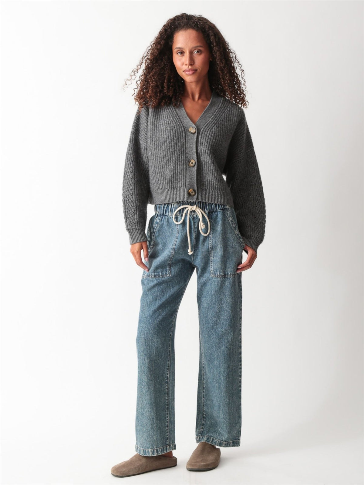 Heather gray ribbed-knit cropped V-neck cardigan with tortoiseshell buttons, styled with drawstring denim, by Electric & Rose