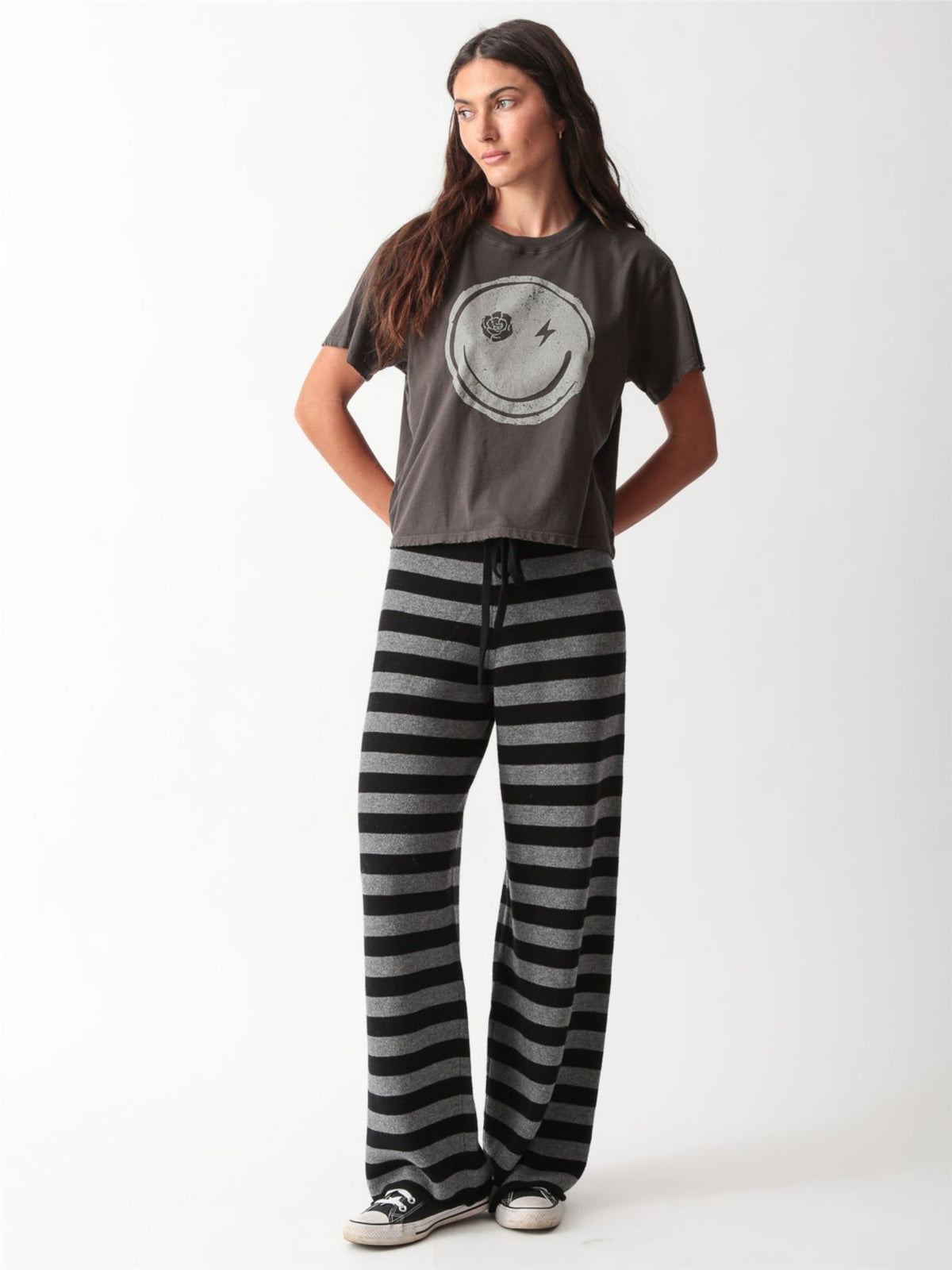 Vintage-wash charcoal graphic tee with a distressed smiley face print featuring a rose and lightning bolt eyes by Electric & Rose