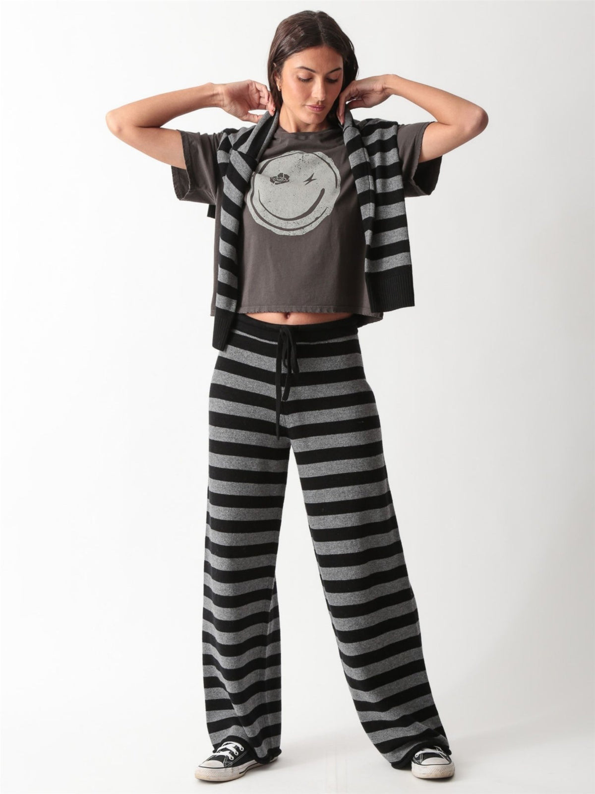 Vintage-wash charcoal graphic tee with a distressed smiley face print featuring a rose and lightning bolt eyes by Electric & Rose