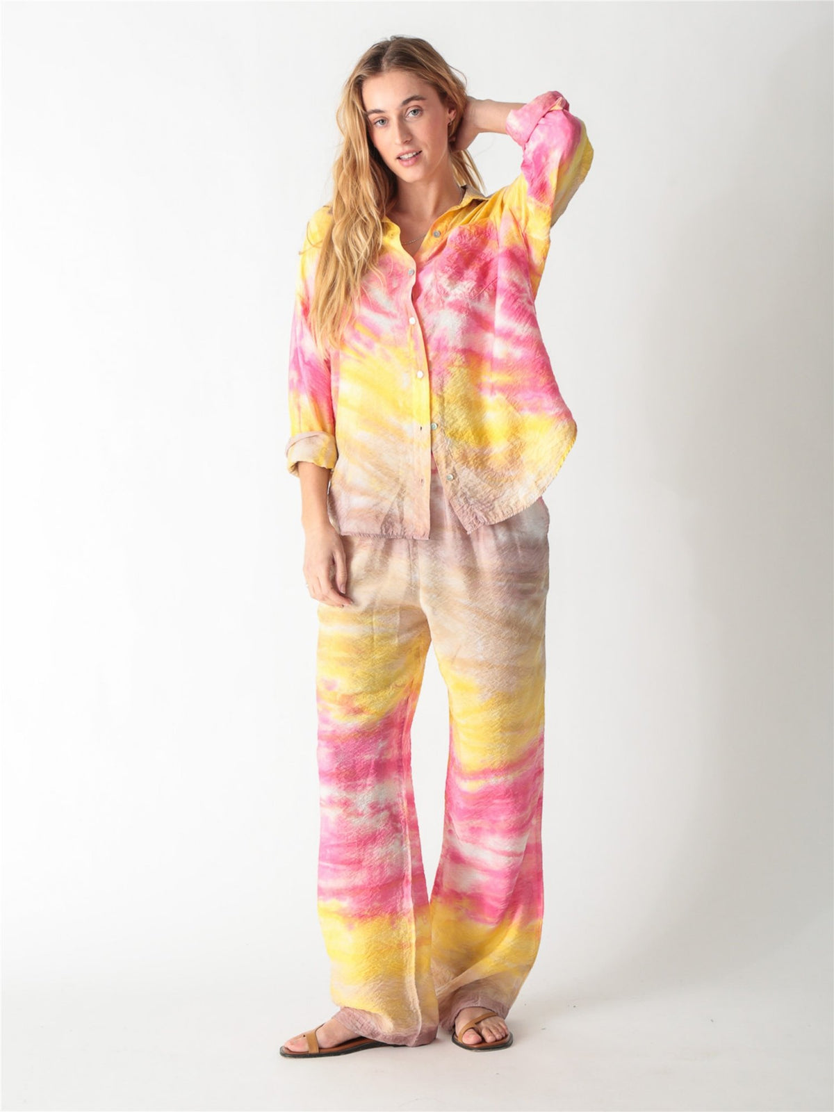 A pink and yellow tie-dye long-sleeve button-down shirt with a classic collar and single chest pocket.