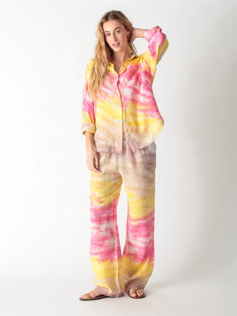A pink and yellow tie-dye long-sleeve button-down shirt with a classic collar and single chest pocket.
