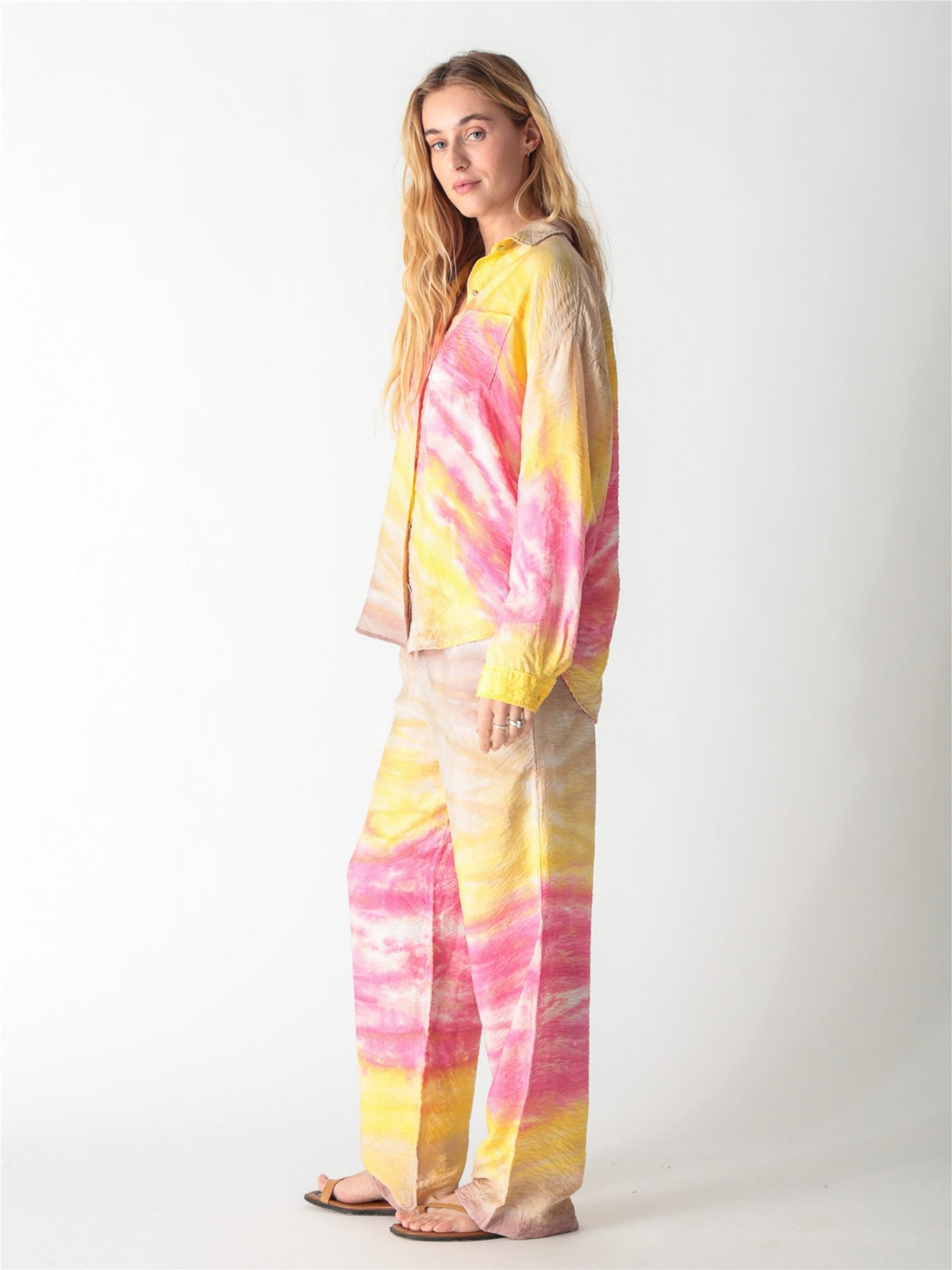 A pink and yellow tie-dye long-sleeve button-down shirt with a classic collar and single chest pocket.