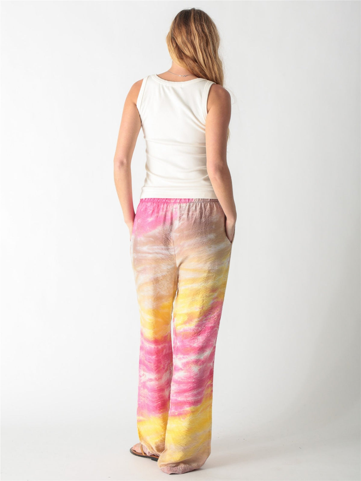 Off-white ribbed tank top with a scoop neckline and thick straps.