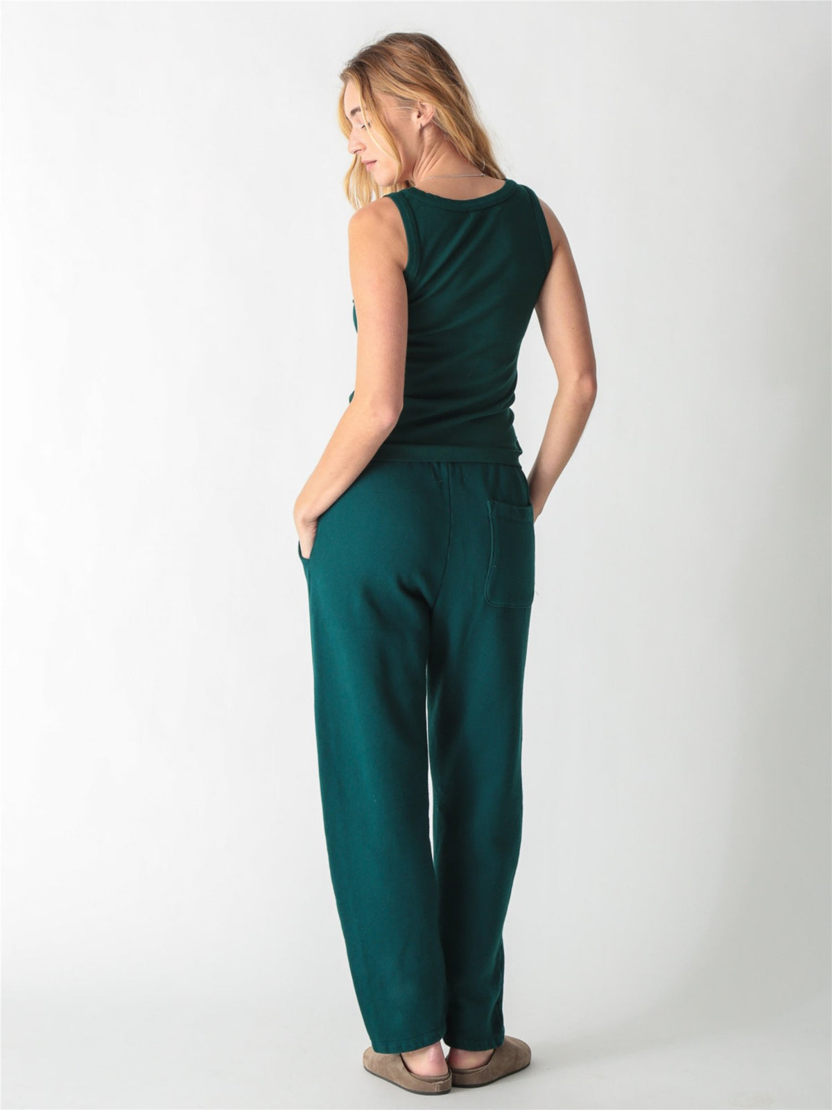 Pine green ribbed tank top with a scoop neckline and thick straps.